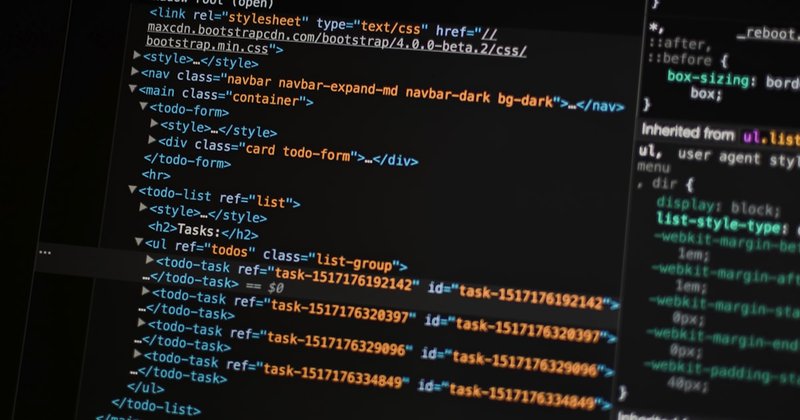 A laptop running a terminal with code on screen, representing the automated kernel test workstation