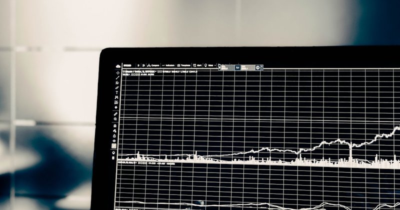 Programming code on a screen showing Python data analysis in a dark-themed code editor
