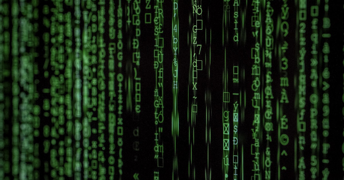 Lines of code cascading on a dark terminal background